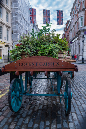 London, England - August 9, 2018: A cart decorated with plant pots in Covent garden Market in London.のeditorial素材