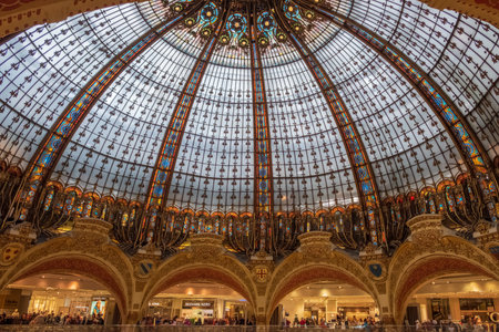 Paris, France - August 7, 2018: Interior view of the Galeries Lafayette Haussmann, a Parisian shopping center located on boulevard Haussmann. The opening dates back to 1912. It is an art nouveau style building.のeditorial素材
