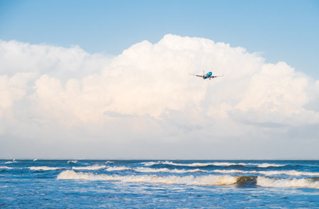 Larnaca, Cyprus - 30 January, 2019: Elal Israel Airlines Boeing 737-800 flying by in white clouds and blue sky, landing at Larnaca International Airport