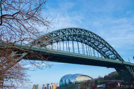 Newcastle, United Kingdom - February 23, 2019: View of the iconic Tyne bridge with Gateshead Sage below it at Newcastle Quaysideのeditorial素材