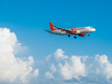 Larnaca, Cyprus - 30 January, 2019: Easyjet Airbus A320 flying by in white clouds and blue sky, landing at Larnaca International Airportのeditorial素材