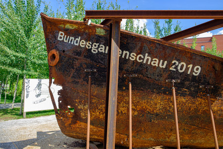 Heilbronn, Germany - August 8, 2019: Rusted ship with the 2019 Federal Garden Show BUGA inscription...