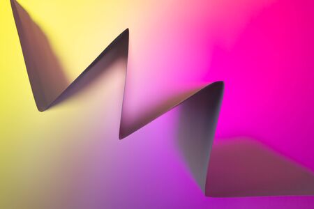 Folded backlit paper abstract accordion shape suitabe as wallpaper. . Shallow depth of field.の写真素材