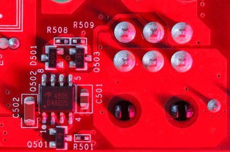Electronic Printed Circuit Board in red with Electronic components viewed from above