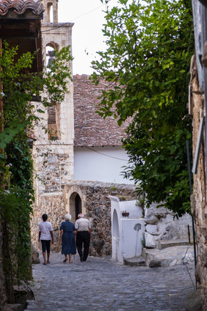 People strolling in the picturesque narrow streets of old Kakopetria in the Troodos mountains in...
