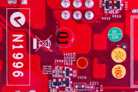 Electronic Printed Circuit Board in red with Electronic components viewed from above