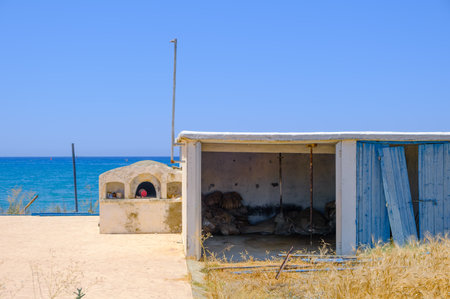 Abandoned construction by a barley field overlooking the sea at Argaka village in Cyprusの写真素材