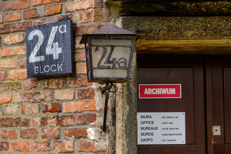 A close-up of the signs for Block 24 at the Auschwitz I camp, with signs in multiple languages...