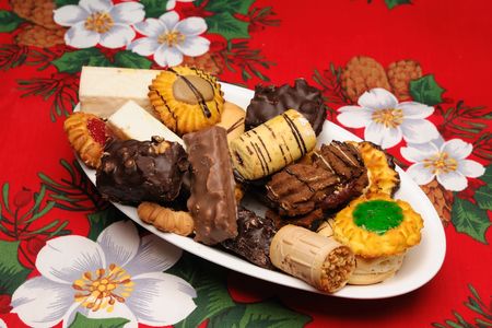 Christmas cakes situated on table cover の写真素材
