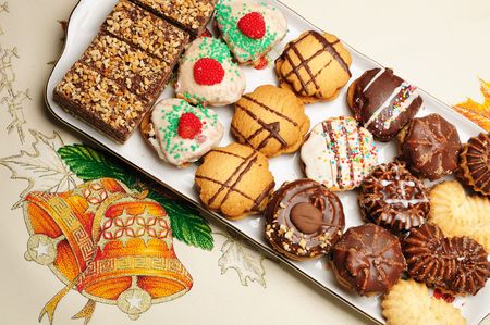 Christmas cakes situated on table cover の写真素材