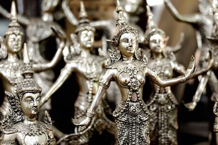 A lot of silver statuettes on the marketの写真素材