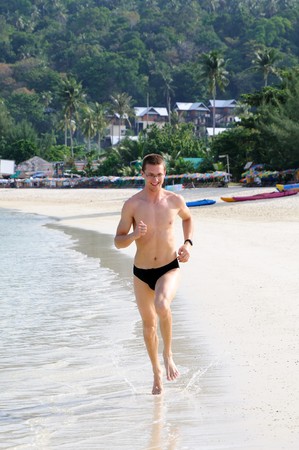 Running man on the beachの写真素材