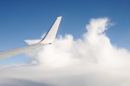 View of plane window with cloudsの写真素材