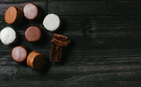 traditional sweet argentinian chocolate biscuit over a black table with a tableclothの写真素材