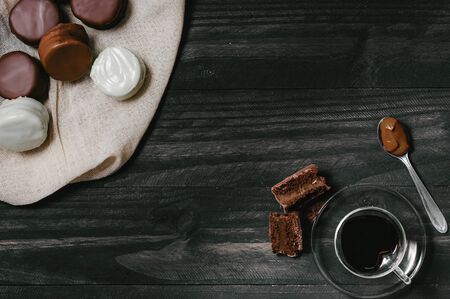 traditional sweet argentinian chocolate biscuit over a black table with a tableclothの写真素材
