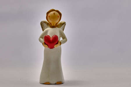 Little White Angel with the Red Heart of Loveの写真素材