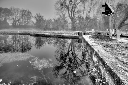 Reflection of a large tree near the lock on the Foug canalの写真素材