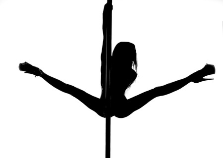 pole dance woman silhouetteの写真素材