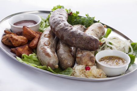 Bavarian sausages with potatoes and sauerkrautの写真素材