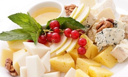 Assorted fruit and cheese , honey and NUTSの写真素材