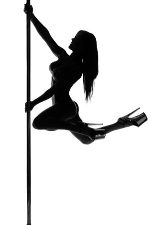 pole dance woman silhouetteの写真素材
