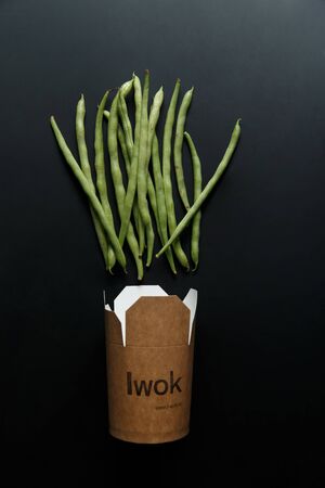 traditional wok noodles in box on dark background