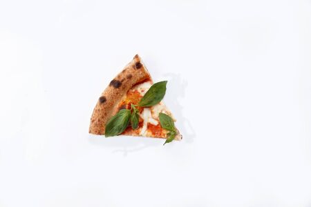 slice of pizza with tomatoes and herbs on a white background
