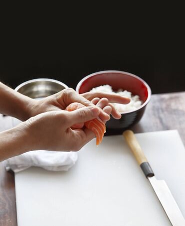 Professional Japanese Chef cooking salmon sushi, selective focusの写真素材