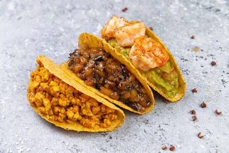 Fresh juicy tacos on a gray background. Close-up. Selective focusの写真素材