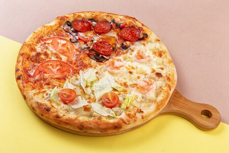 assorted pizza on a wooden plate. Selective focusの写真素材