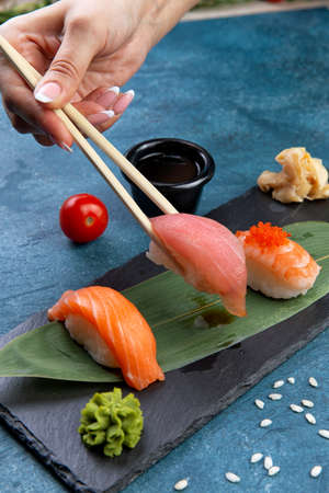 Classic sushi. with salmon, tuna and shrimp. classic Japanese sushi. Traditional Japanese food with maki. Delicious pieces of sushiの写真素材