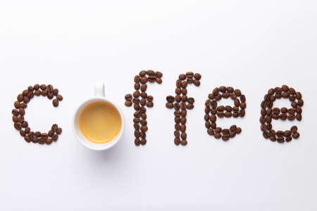 word coffee lined with coffee beans on white backgroundの写真素材