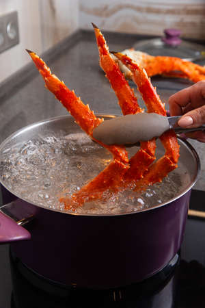 The crab is boiled in a saucepan. Selective focusの写真素材