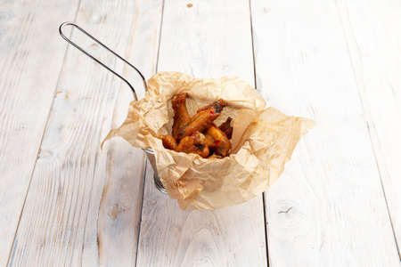 Fried chicken wings and legs. On a light background. Selective focusの写真素材