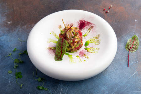 Vegetable tartare in a plate. selective focusの写真素材