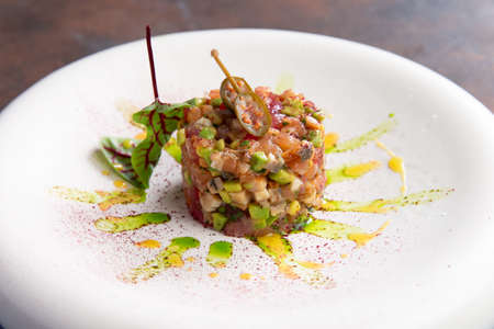 Vegetable tartare in a plate. selective focusの写真素材
