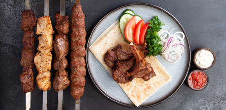 Platter of kebabs. Kebab chicken, kebab with lamb, a shish kebab of chicken and lamb skewers