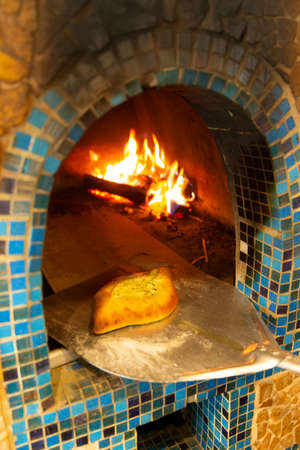 Cooking khachapuri (traditional Georgian dish) in the ovenの写真素材