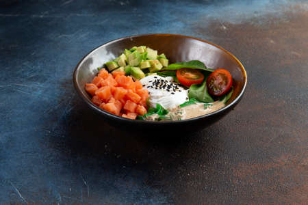 Hawaiian salmon Poke Bowl with avocado and cucumber. Sushi bowl. Organic and healthy food.の写真素材