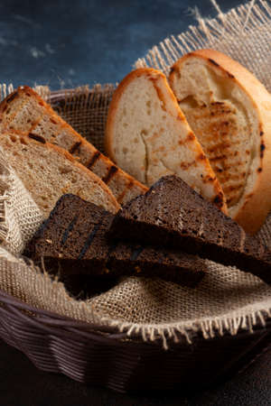 Bread basket, various sliced and fried breads. Selective focus
