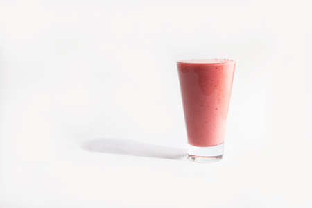 pink milkshake in a glass. Smoothie. isolated on white background