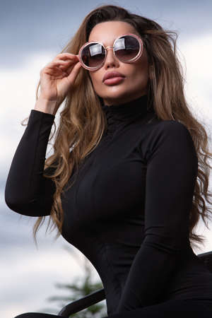 Young girl in sunglasses. Close-up portrait. Selective focusの写真素材