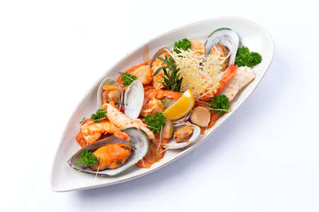 Assorted seafood in a plate. Isolated on white background. Selective focusの写真素材