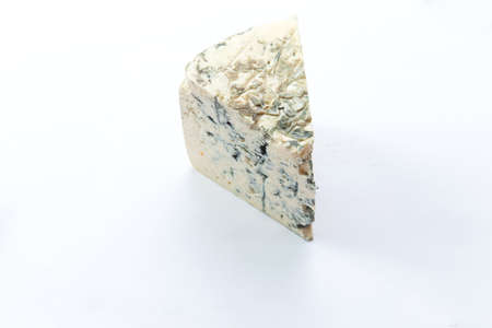 A piece of blue cheese. Isolated on white. Selective focus.の写真素材