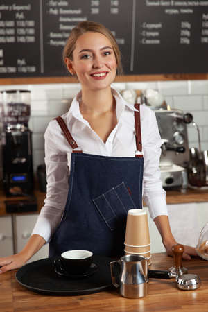 The girl accepts the order at the counter. Selective focus.の写真素材