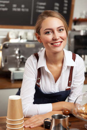 The girl accepts the order at the counter. Selective focus.の写真素材