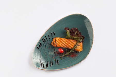 Salmon steak in a plate. On white background. View from above.の写真素材