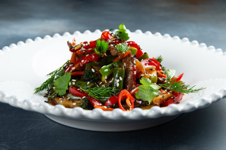 Salad with beef, pods and hot peppers. close-up. selective focus.の写真素材