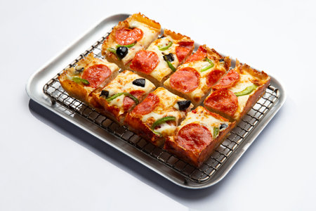 detroit pizza on an iron tray on a light background. selective focusの写真素材