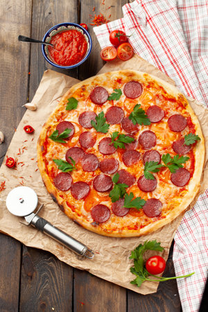 Pepperoni pizza on a wooden table. view from above.の写真素材